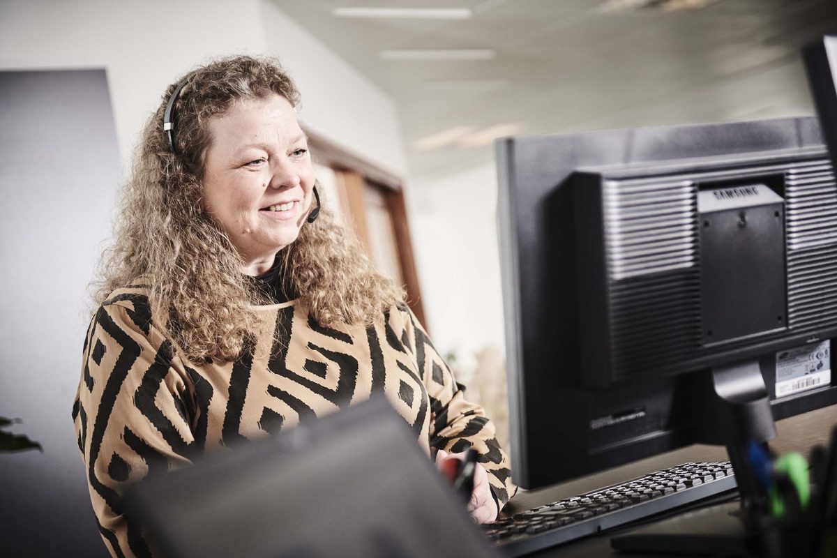 Et billede af en medarbejder hos InfoSuite, som hedder Marianne Bjerg